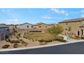 Neighborhood park featuring a green space, benches, landscaping, and walking path for residents at 7462 Dragonfruit Ave, Las Vegas, NV 89113