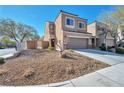 Beautiful home featuring desert landscaping, private gate, and an attached two-car garage at 8429 Spirit Vale Ave, Las Vegas, NV 89117