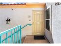 Inviting front entrance with a secure door and a well-lit porch area at 8452 Boseck Dr # 285, Las Vegas, NV 89145