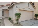 View of a charming single-story home with a two-car garage and a stucco exterior at 8605 Wild Diamond Ave, Las Vegas, NV 89143