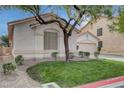 View of a charming single-story home featuring a well-manicured front yard and a stucco exterior at 8605 Wild Diamond Ave, Las Vegas, NV 89143