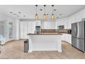 Spacious kitchen featuring stainless steel appliances, generous cabinets, and tiled flooring at 8629 Estrelita Dr, Las Vegas, NV 89128