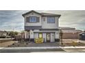 Two-story model home showcasing a well-maintained front yard, attractive landscaping, and a welcoming entrance at 8917 Pebble Sand St, Las Vegas, NV 89178