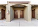 Exterior view of condominium entrances showcasing unit doors and exterior architecture under covered entryway at 9000 Las Vegas Blvd # 2243, Las Vegas, NV 89123