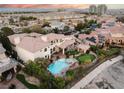 Expansive backyard featuring a sparkling pool, spa, putting green, and an outdoor gazebo at 9325 Verlaine Ct, Las Vegas, NV 89145