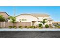 Exterior view of home featuring neutral paint, desert landscaping, and modern style at 11204 Newbury Hills Ave, Las Vegas, NV 89138