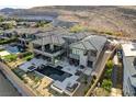 Expansive aerial view of the home highlighting the pool, outdoor spaces, and surrounding neighborhood at 11296 Villa Bellagio Dr, Las Vegas, NV 89141