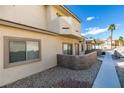 Inviting townhome with well-kept facade, private patio, and lush landscaping at 2050 Los Feliz St # 112, Las Vegas, NV 89156