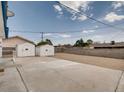 Spacious backyard featuring two storage sheds at 2712 Royal St, North Las Vegas, NV 89030