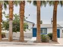 Charming single-story home with blue trim and door at 2712 Royal St, North Las Vegas, NV 89030