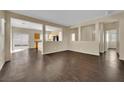 Open-concept living room featuring hardwood floors and ample natural light at 3941 Yellow Mandarin Ave, North Las Vegas, NV 89081