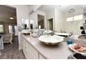 Elegant bathroom with a shell-shaped vessel sink, granite countertops, and a large mirror at 4300 S Gressa St, Pahrump, NV 89061