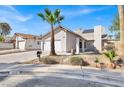 Attractive home with a two-car garage, desert landscaping, and solar panels on the roof at 4809 Mountain Valley Rd, Las Vegas, NV 89121