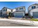 Charming two-story home featuring a two-car garage, front yard, and driveway at 5382 El Nevero St, Las Vegas, NV 89166