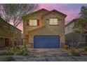 Charming two-story home with landscaped yard and a two-car garage in a residential neighborhood at 6629 Breakwater Reef St, Las Vegas, NV 89149