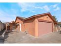 Side view of a single-story home showing the entrance, garage, and enclosed porch at 706 Morrocco Dr, Henderson, NV 89002