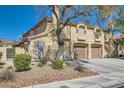 Charming two-story house featuring a two-car garage, complemented by mature landscaping at 7632 Amato Ave, Las Vegas, NV 89128