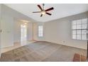 Comfortable living room with carpet and a glimpse of the entry area at 7719 Selby Ct, Las Vegas, NV 89147