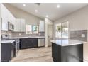 Well-lit kitchen equipped with stainless steel appliances and sleek countertops at 8745 Point Kathy Cir, Las Vegas, NV 89147