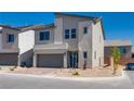 Charming two-story home featuring a modern design, a two-car garage, and a brick driveway at 10246 Bloom Quick Ct, Las Vegas, NV 89141