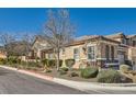 Inviting single story home with manicured landscape and stone accents on the facade at 1045 Chestnut Chase St, Las Vegas, NV 89138