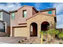 Inviting two-story home with brick-covered entryway and attached two-car garage at 11572 Salt Creek Ave, Las Vegas, NV 89138
