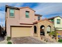 Beautiful two-story home with a brick-accented entrance and a spacious two-car garage at 11572 Salt Creek Ave, Las Vegas, NV 89138