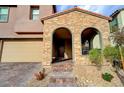 Inviting brick entryway with a cozy seating area and shade at 11572 Salt Creek Ave, Las Vegas, NV 89138