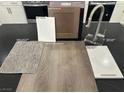 Kitchen design layout displays cabinet, flooring, countertop, carpet, and paint samples with stainless appliances at 1513 Bat Hawk St, Las Vegas, NV 89144