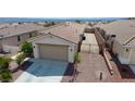 View of a house featuring desert landscaping, tile roof, and convenient RV parking at 2351 Thornwood Castle Dr, Laughlin, NV 89029