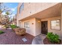 Cozy condo unit featuring a private front entrance, small garden and desert rock landscape at 2667 Aracatuba Ave, Las Vegas, NV 89121