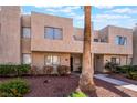 Attractive townhouse with a tidy front yard and desert-friendly plants enhancing its curb appeal at 2667 Aracatuba Ave, Las Vegas, NV 89121