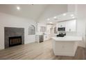 Modern kitchen with white cabinets, stainless appliances, quartz countertop island and vaulted ceilings at 2925 Wigwam Pkwy # 923, Henderson, NV 89074