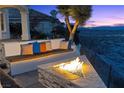 Patio featuring a fire pit and bench with plush pillows at 37 Avenida Fiori, Henderson, NV 89011