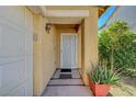 Close-up of the front entryway with security door, desert foliage and a decorative potted plant at 3960 Badgerbrook St, Las Vegas, NV 89129