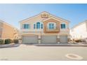 Inviting exterior view of townhomes with attached garages and well-maintained landscaping at 4847 Double Down Dr # 101, Las Vegas, NV 89122