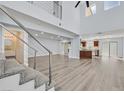 Bright living room with vaulted ceilings, modern flooring, and an open floor plan at 5421 Painted Mirage Rd, Las Vegas, NV 89149