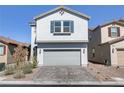 Charming two-story home with a two-car garage and desert landscaping at 7256 Saxby Ave, Las Vegas, NV 89113