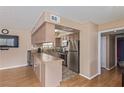 Open kitchen area with stainless steel appliances, and extended tile countertops at 101 Luna Way # 226, Las Vegas, NV 89145