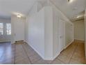 Inviting foyer with tile flooring, neutral walls, and a view of the front door and hallway at 1035 Dodger Blue Ave, Las Vegas, NV 89123