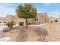 Inviting single-story home with well-maintained desert landscaping and a rock garden at 2404 Garganey Ave, North Las Vegas, NV 89084