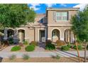 Inviting two-story home with well-maintained landscaping, covered entryway, and a tile roof at 2894 Via Firenze, Henderson, NV 89044