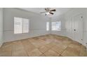 Spacious living room with neutral walls, tile flooring, and lots of natural light at 3705 Covewick Dr, North Las Vegas, NV 89032