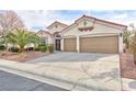 Charming single story home featuring a three car garage and meticulously landscaped front yard with mature desert trees at 3957 Genoa Dr, Las Vegas, NV 89141