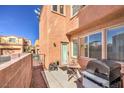 Back patio with neutral wall, space to grill, and low-maintenance landscape at 6687 Higger Tor Ave, Las Vegas, NV 89139