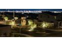 Nighttime view of the neighborhood with a skyline view in the background at 796 Keys View Ave, Las Vegas, NV 89138