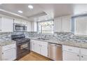 Traditional-style kitchen featuring stainless steel appliances and beautiful granite countertops at 8229 Willeta Ave, Las Vegas, NV 89145