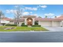 Charming single story home with well-manicured lawn and inviting red tile roof at 8701 Robinson Ridge Dr, Las Vegas, NV 89117