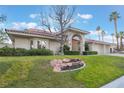 Charming single story home with manicured lawn and unique rock landscaping at 8701 Robinson Ridge Dr, Las Vegas, NV 89117