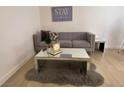 Cozy living room featuring a comfortable gray sofa and a modern mirrored coffee table at , Las Vegas, NV 89102